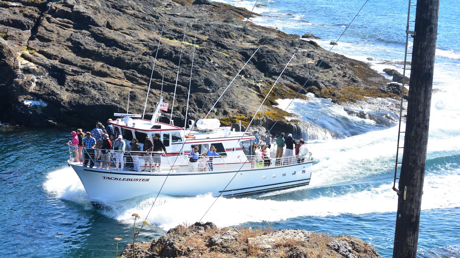 Charter boat 'Tacklebuster' entering the harbor at Depoe Bay, Oregon
